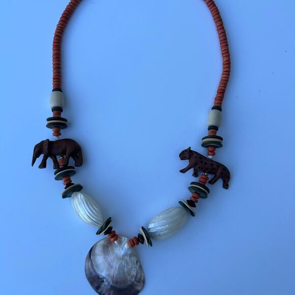 Necklace with safari vibe, hand carved elephant, and leopard, seashells & beads - Picture 1 of 11